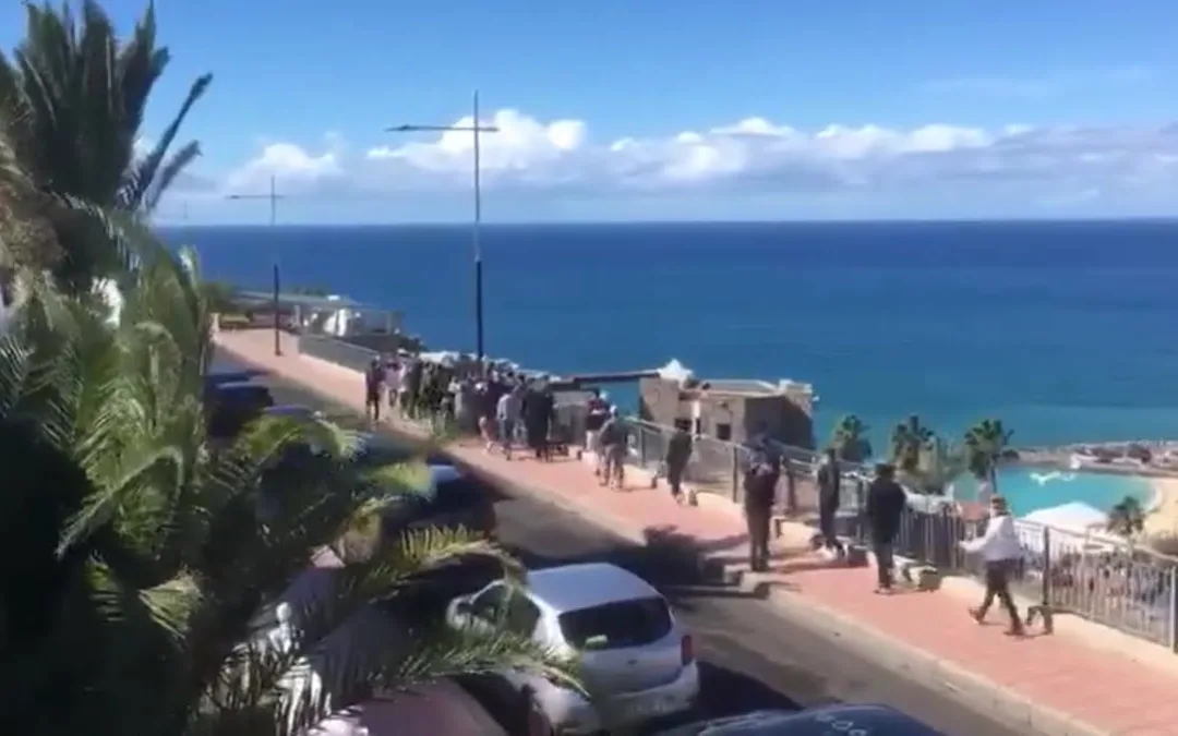 30-40 North African migrants march in brief Puerto Rico protest overlooking Amadores Beach in Mogán