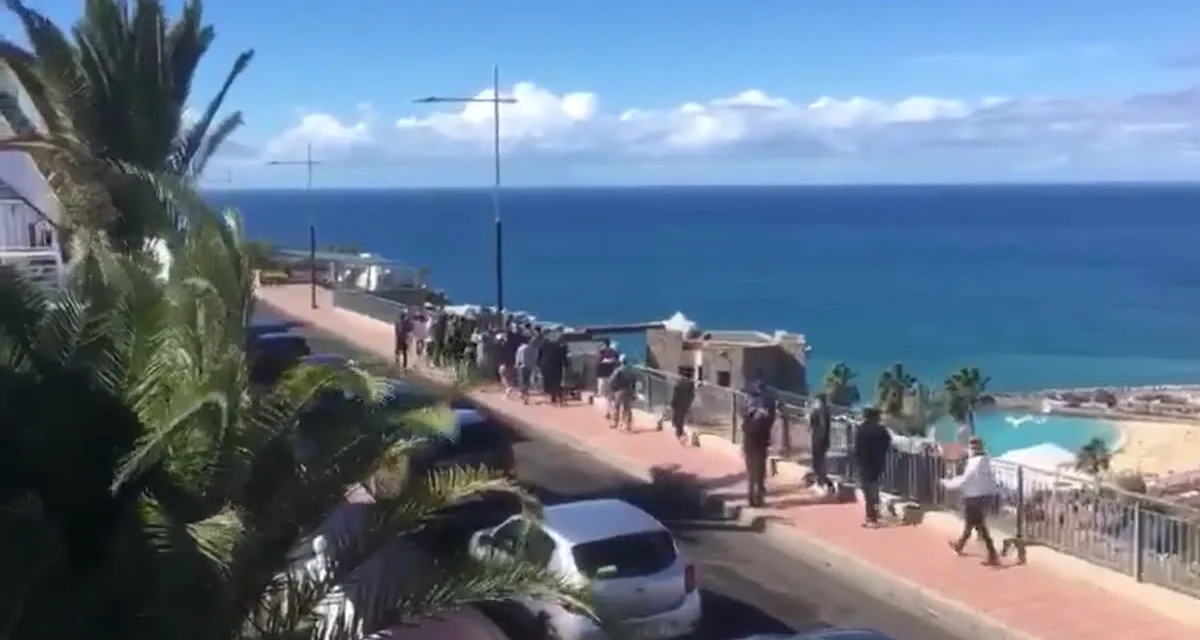30-40 North African migrants march in brief Puerto Rico protest overlooking Amadores Beach in Mogán