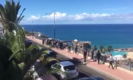 30-40 North African migrants march in brief Puerto Rico protest overlooking Amadores Beach in Mogán