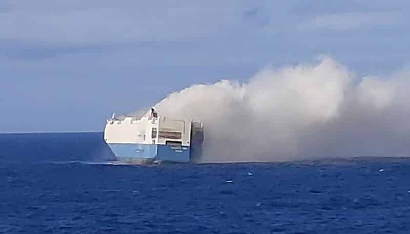 The Crew of a Cargo ship have had to be evacuated after a fire aboard the vessel carrying high end automobiles to America